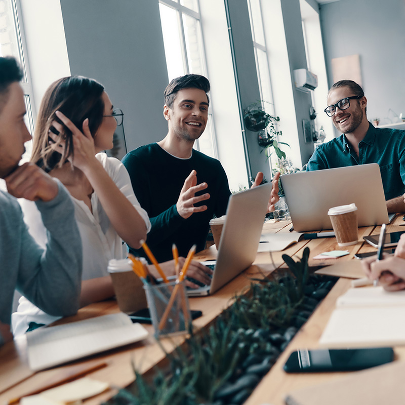 image of marketing team having a meeting in office at conference table